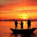 Silhouette of The Wong Family joyfully fishing together during a beautiful sunset